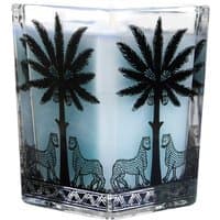 Florio square candle with blue wax in a glass holder, featuring black palm trees and leopards design.