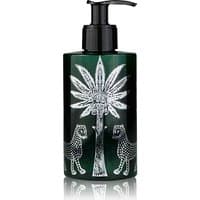 Dark green Ortigia Lime di Sicilia body cream bottle with black pump, featuring white palm tree and leopard design.