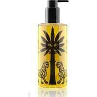 Ortigia Zagara Shower Gel 250 ml, amber liquid in clear bottle with black pump, palm tree and leopard design.