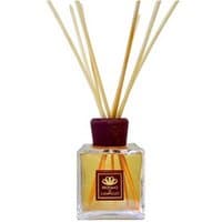 Square glass diffuser with brown cap, filled with yellow liquid and reed sticks, labeled "Profumo di Campiglio."