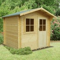 Wooden log cabin summerhouse with pitched roof, single door, and two front windows, set in a grassy garden.