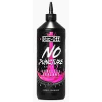 Muc-Off No Puncture Hassle Tubeless Sealant 1L, black bottle with pink splash design and pointed nozzle.