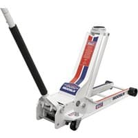White Sealey 1.5 tonne low profile trolley jack with rocket lift, black handle, and red-blue accents.