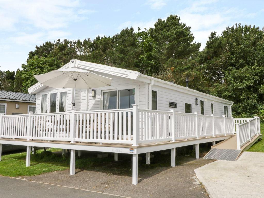 Charming lodge located on Cayton Bay Holiday Park image one