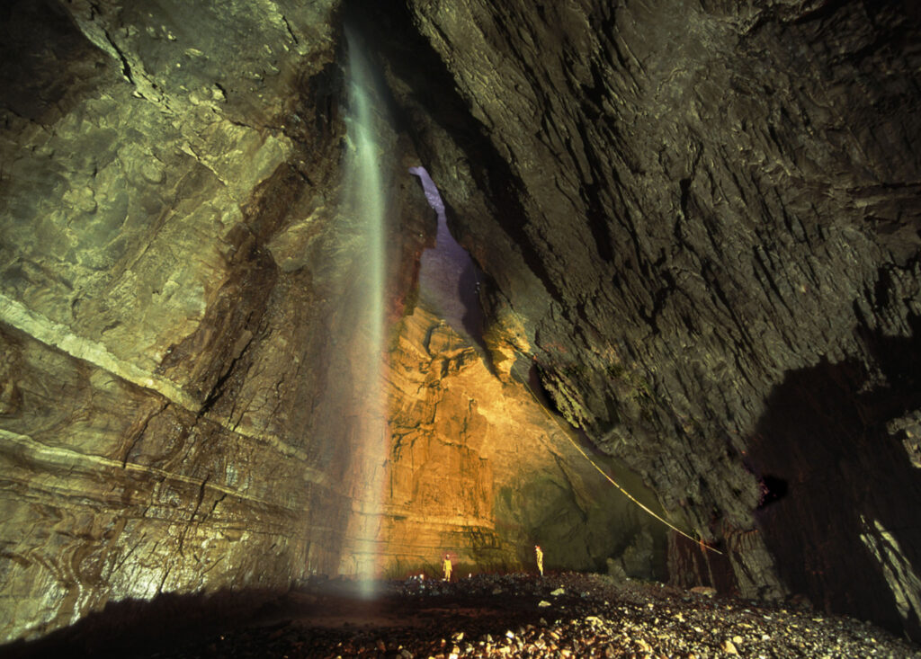 Gaping Gill - the inside of a large cavern, with a waterfall entering from above, directly
