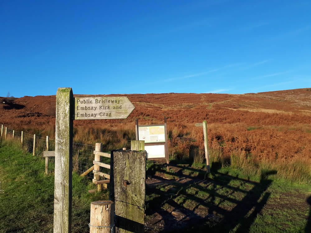 Image name embsay crag signpot the 1 image from the post Embsay Reservoir and Embsay Crag Walk in Yorkshire.com.