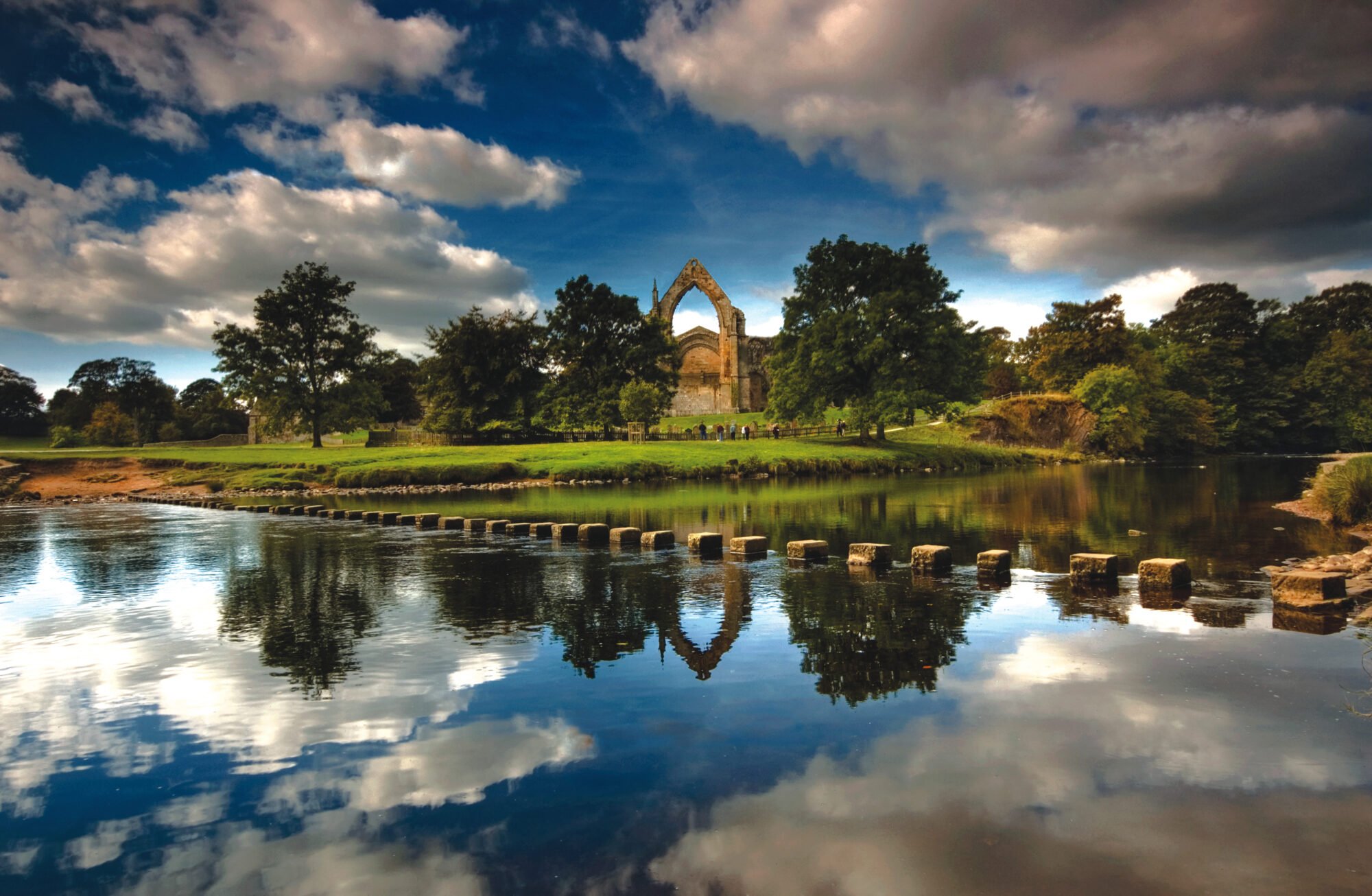 view of Bolton Abbey over lake