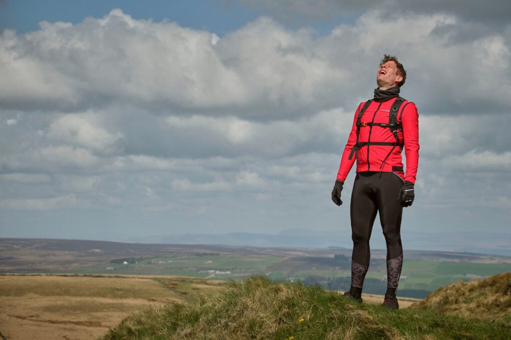 James Norton as Tommy Lee Royce in Happy Valley 3, cycling outfit above Warley Moor reservoir