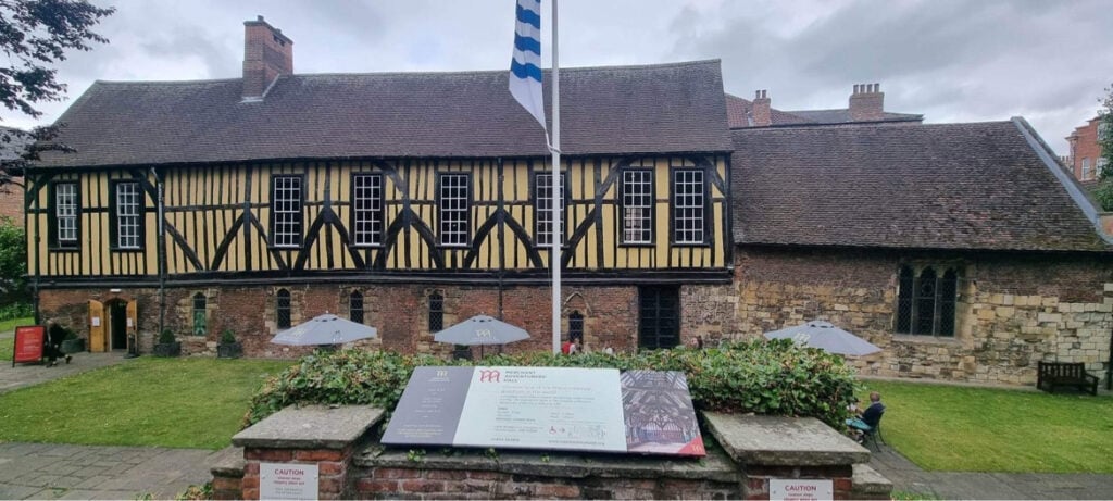 Image name information board merchant adventurers hall york yorkshire the 2 image from the post TV Historian, Dr Emma Wells, examines the Merchant Adventurers’ Hall, York in Yorkshire.com.