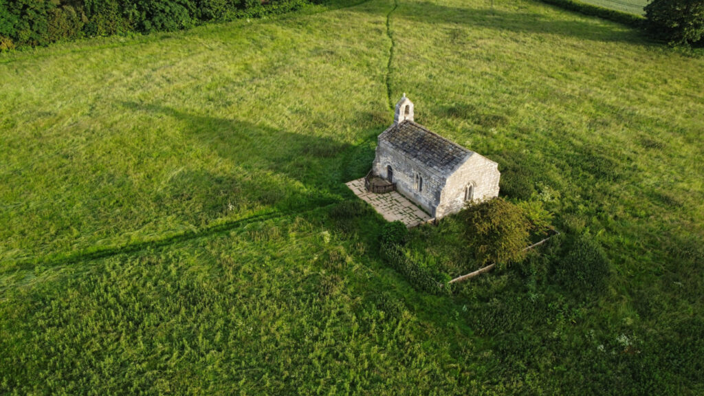 Saxton, North Yorkshire, England, Britain, June 2022, Aerial view of ancient small medieval chapel near Towton battlefield called St. Mary's chapel