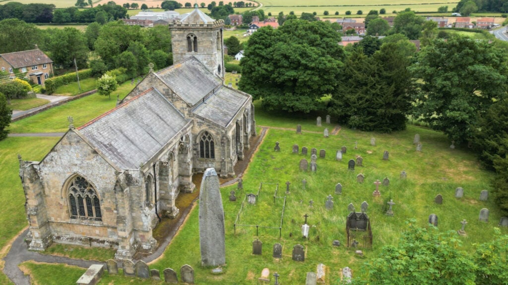 Image name rudston church and rudston monolith east yorkshire the 2 image from the post A look at the history of the Rudston Monolith, with Dr Emma Wells in Yorkshire.com.