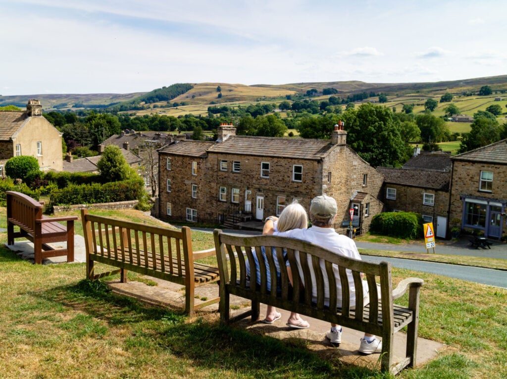 Image name elderly couple bench yorkshire the 2 image from the post Romantic Valentine's Getaways in Yorkshire: From Magical Proposals to Cosy Stays in Yorkshire.com.