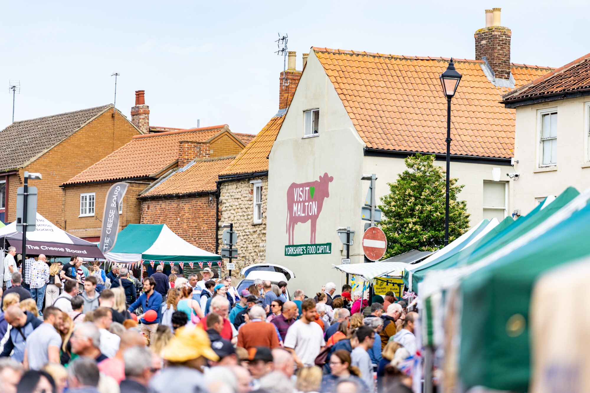 Image name Crowds Market Place East. Malton Food Festival 3 June 2022. Photo Credit milnerCreative on behalf of Visit Malton the 1 image from the post Malton Food Lovers Festival (Spring) in Yorkshire.com.