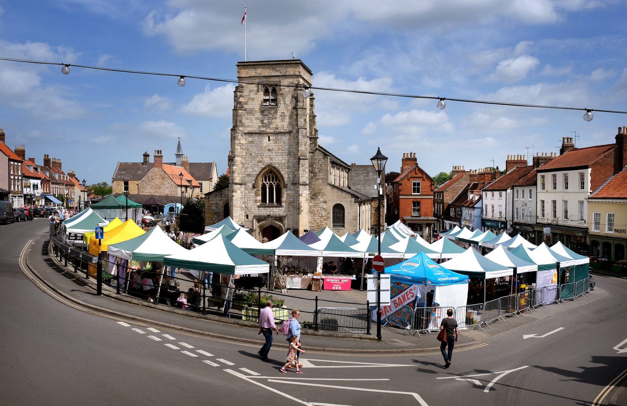 Image name Wider shot Market Place Stalls May 2022. Photographer Credit Richard Ponter on behalf of Visit Malton CIC1 the 5 image from the post Malton Monthly Food Market in Yorkshire.com.